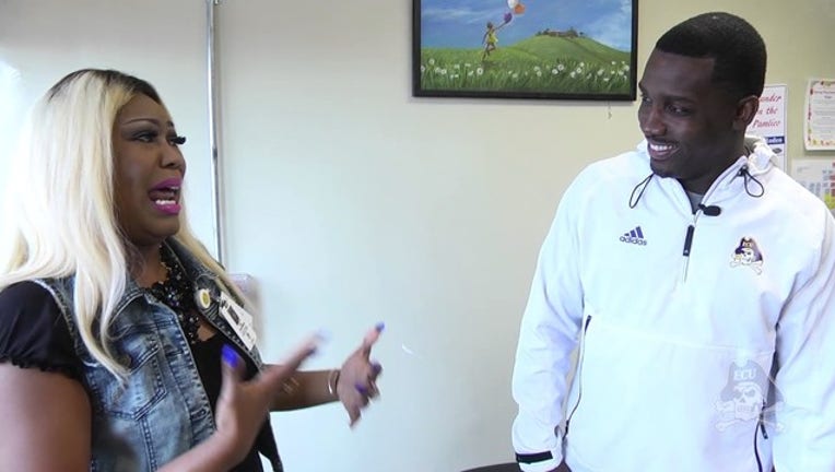 ECU coach gives surprise mother's day gift_1494598052742-403440.jpg