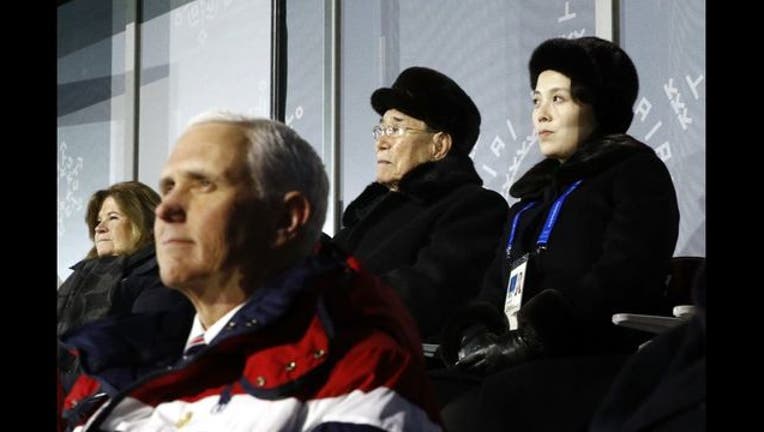 056cab8d-Kim Jong Un sister behind Pence GETTY-409162