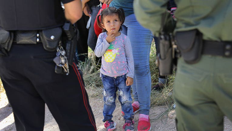 018e49da-GETTY-migrant-children-Border-Patrol_1556311235658-407068.jpg
