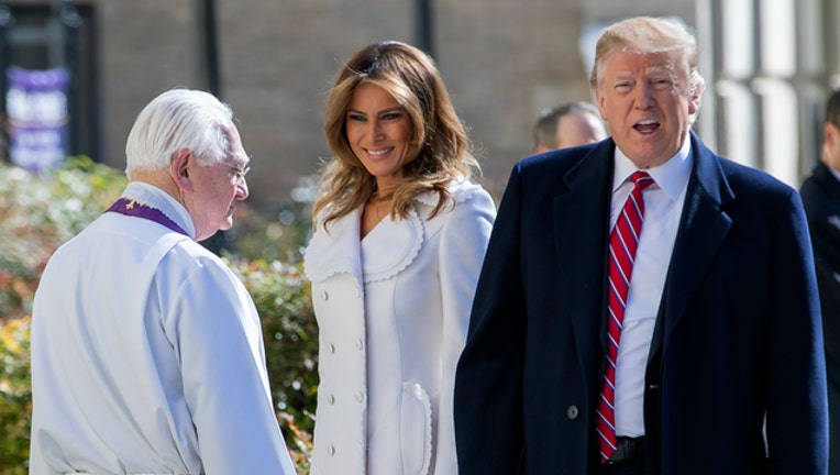 12326539-GETTY Melania and Donald Trump attend church-404023