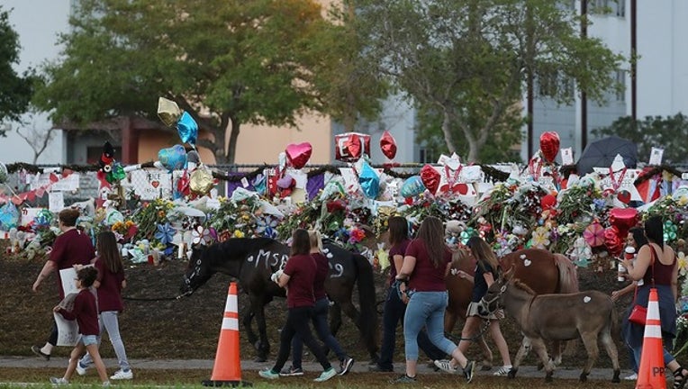 8158f29b-GETTY parkland majory stoneman douglas high school memorial_1530626249686.png.jpg