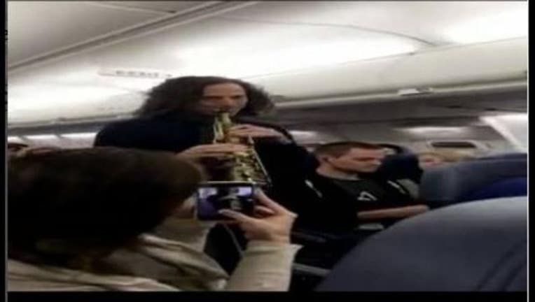 2e2f9478-Kenny G on a plane_1492977494326.JPG