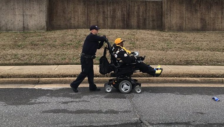 9eea5e98-MEMPHIS PD_wheelchair and officer_010619_1546791839874.png.jpg