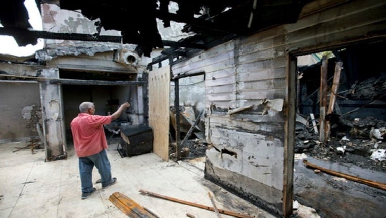 a2f9f062-Mosque-Burned-Down_1486432944667.JPG