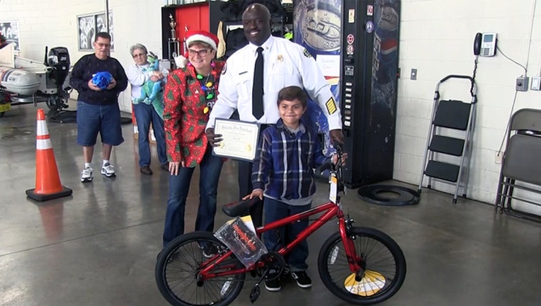 2a01a31a-boy-gets-bike-Orlando-firefighters_1545267220220.jpg