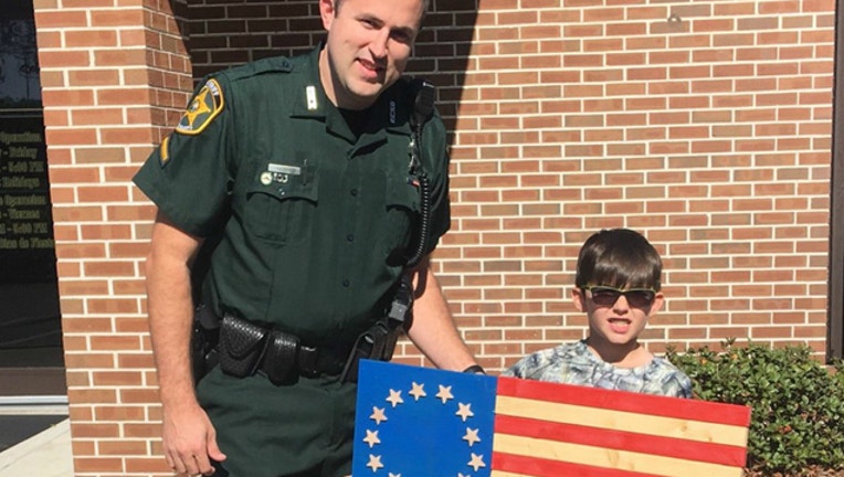 ed3a0b5a-christmas boy police wood flag_1514244948993.jpg.jpg