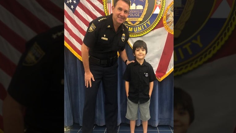 c95f3694-cop and kid web pic_1551463397168.png.jpg