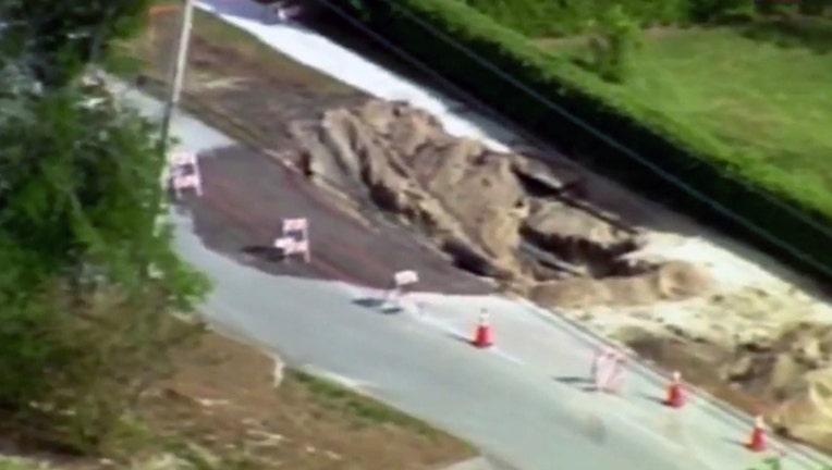 92bdc8a2-long-pond-road-sinkhole_1522183143566.jpg