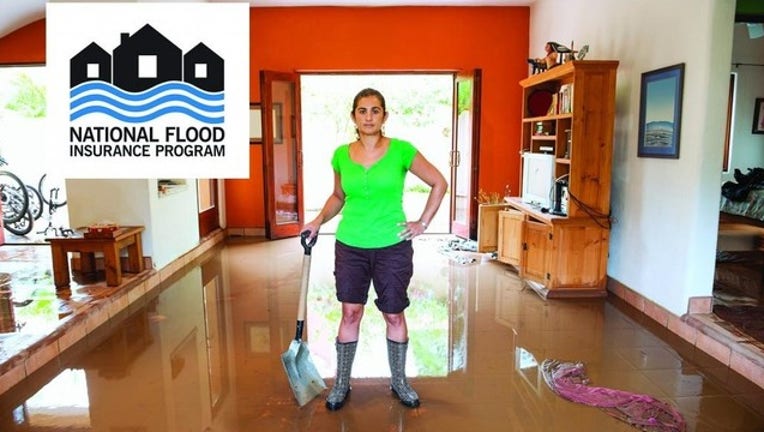 245519fe-nfip_flood_lady_room_fs_logo3_1556744441139-408795.jpg