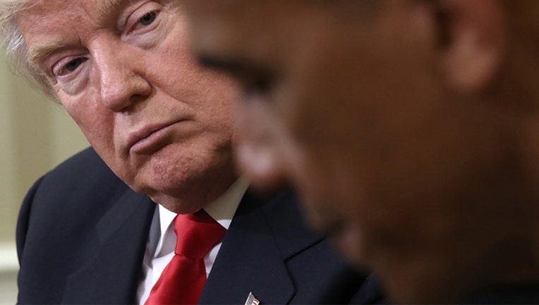 55a4aa1b-obama-trump-getty_1531578844778-401720.jpg