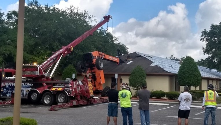 1a3153db-sarasota tractor roof_1523275464744.png.jpg