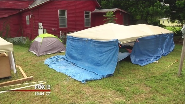 656b3615-Tents outside of homeless shelter