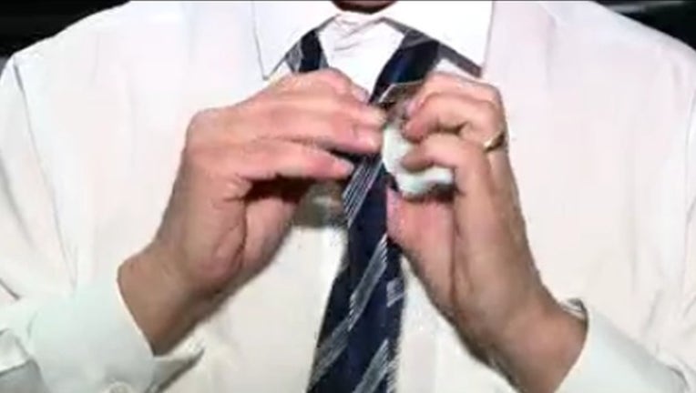 ac27786d-wofl_tying a tie_020319_1549248759090.png.jpg