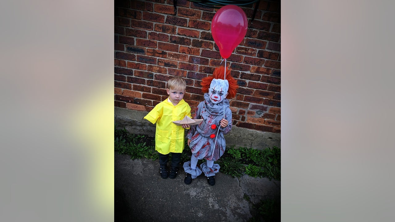 Brothers transform into 'Pennywise' and 'Georgie' for delightfully spooky  Halloween costume