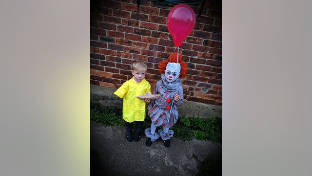 Brothers transform into 'Pennywise' and 'Georgie' for delightfully spooky Halloween costume