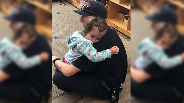 Viral photo shows firefighter comforting preschooler recently diagnosed with autism