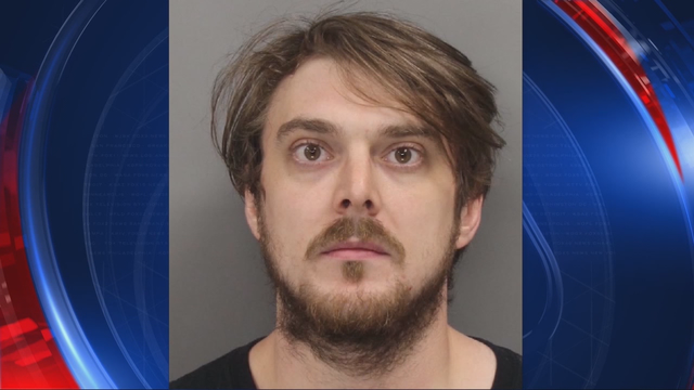 Police: Man threatens woman, baby with sword