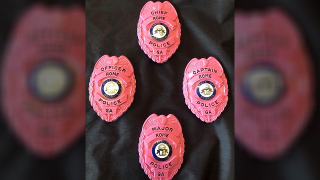 Officers in Georgia wear pink badges to commemorate Breast Cancer Awareness Month