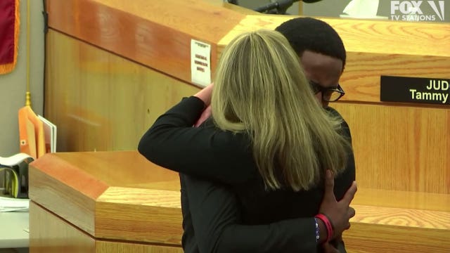 ‘I love you as a person': Botham Jean's brother hugs Amber Guyger after she gets 10 years in prison