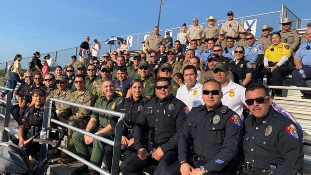 Police department packs stands to watch son of fallen officer play first football game