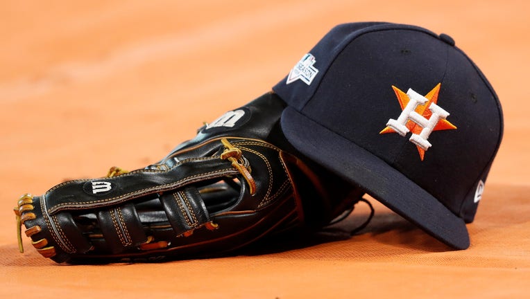HOUSTON, TX - OCTOBER 19: A Houston Astros hat and glove are seen on the field before Game Six of the League Championship Series against the New York Yankees at Minute Maid Park on October 19, 2019 in Houston, Texas. (Photo by Tim Warner/Getty Images)