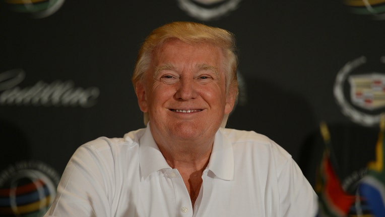 Donald Trump talks to the media during an early practice round at the World Golf Championships-Cadillac Championship at the Doral Golf Resort and Spa on Tuesday, March 5, 2013, in Miami, Florida. (Photo by Ron Elkman/Sports Imagery/ Getty Images)