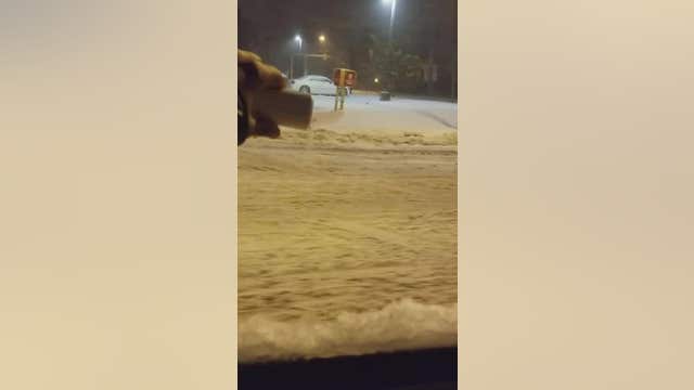 New Yorker 'salts' roads after heavy snowfall