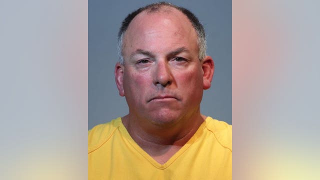 P.E. coach arrested, accused of grabbing student and shoving him against a wall