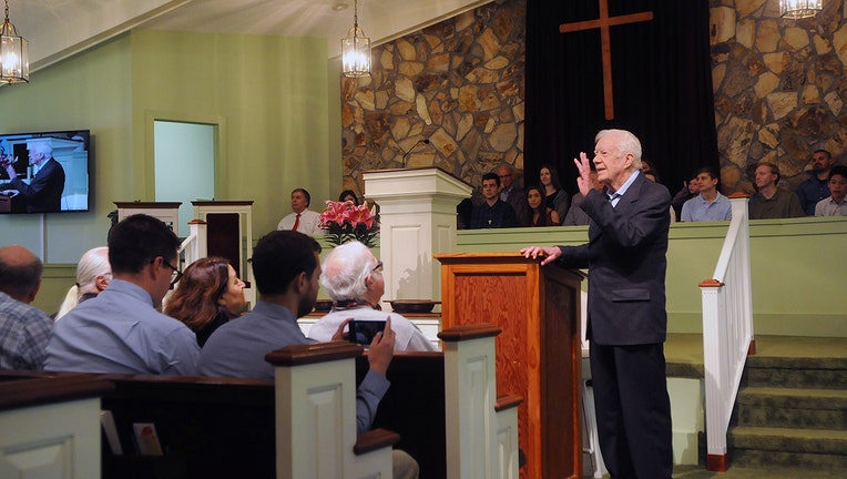 Former U.S. President Jimmy Carter speaks to the congregation at Maranatha Baptist Church before teaching Sunday school in his hometown of Plains, Georgia on April 28, 2019. Carter, 94, has taught Sunday school at the church on a regular basis since leaving the White House in 1981, drawing hundreds of visitors who arrive hours before the 10:00 am lesson in order to get a seat and have a photograph taken with the former President and former First Lady Rosalynn Carter. (Photo by Paul Hennessy/NurPhoto via Getty Images)