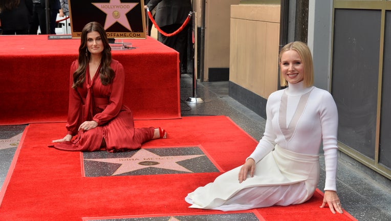 HOLLYWOOD, CALIFORNIA - NOVEMBER 19: Idina Menzel (L) and Kristen Bell (C) are honored with stars on the Hollywood Walk of Fame on November 19, 2019 in Hollywood, California. (Photo by Jerod Harris/Getty Images)