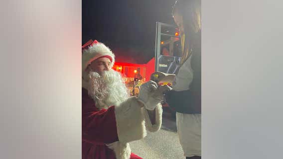 ‘She said YES!’: Firefighter dressed as Santa proposes girlfriend on Christmas Eve