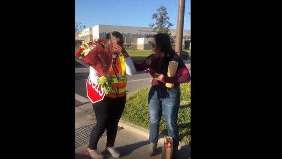 Parents, students at Orlando elementary school surprise crossing guard with holiday gifts