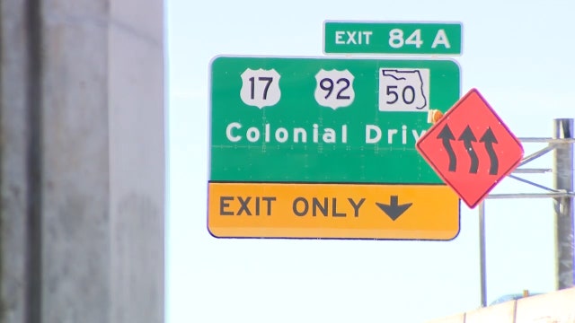 Westbound I-4 exit at Colonial Drive shifts from right to left side of road