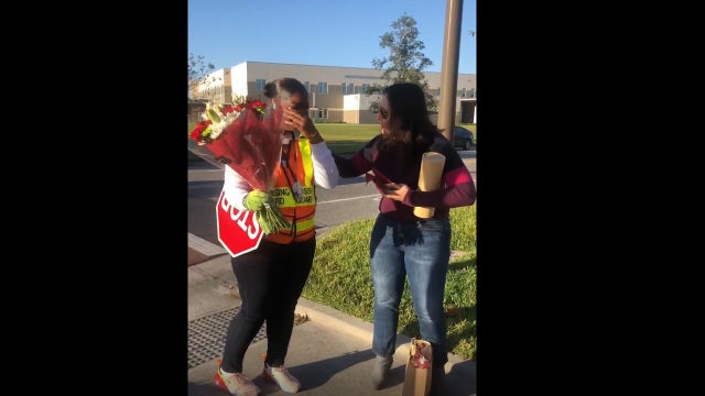 Parents, students at Orlando elementary school surprise crossing guard with holiday gifts