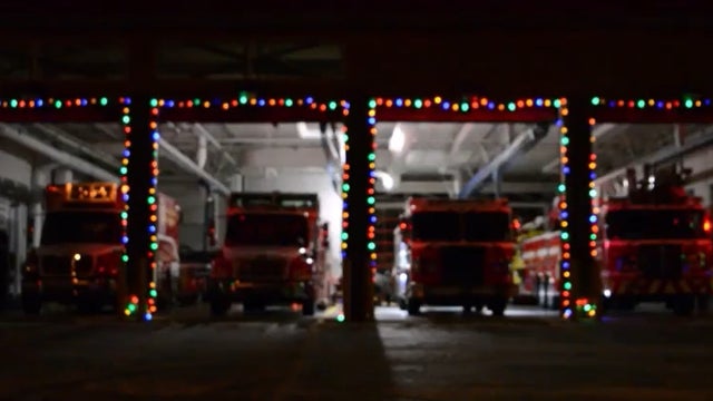Fire engines put on festive light display to 'Carol of the Bells'