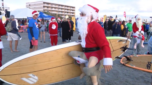 Surfing Santas hit Cocoa Beach