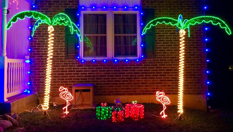 Christmas tree lights with palm trees and flamingos.
