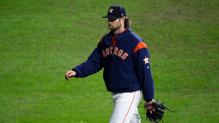 HOUSTON, TEXAS - OCTOBER 30: Gerrit Cole #45 of the Houston Astros walks to the bullpen during the fifth inning against the Washington Nationals in Game Seven of the 2019 World Series at Minute Maid Park on October 30, 2019 in Houston, Texas. (Photo by Tim Warner/Getty Images)