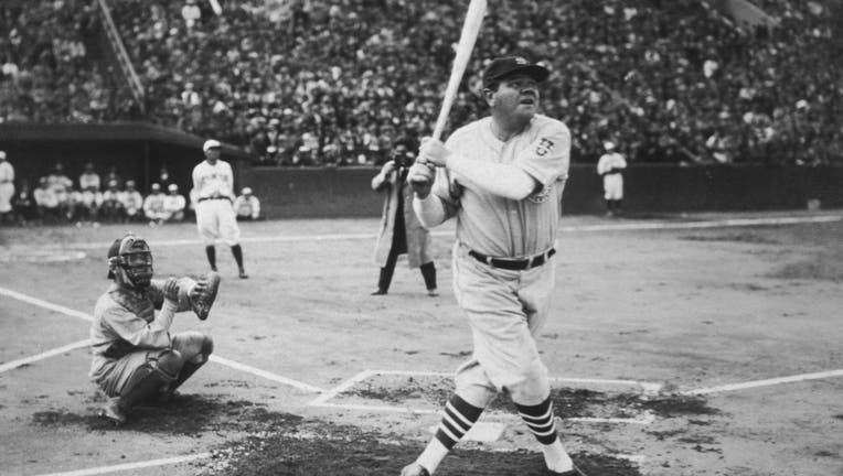 1934: American baseball player Babe Ruth (George Herman Ruth, 1895 - 1948) hits his first home run during his tour of Japan at Miji Shrine Stadium, Tokyo, Japan. (Photo by New York Times Co./Getty Images)