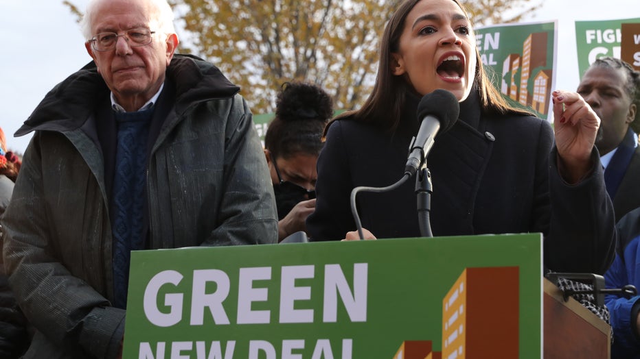 Democratic presidential candidate Sen. Bernie Sanders (I-VT) (L) and Rep. Alexandria Ocasio-Cortez (D-NY) hold a news conference to introduce legislation to transform public housing as part of their Green New Deal proposal outside the U.S. Capitol.