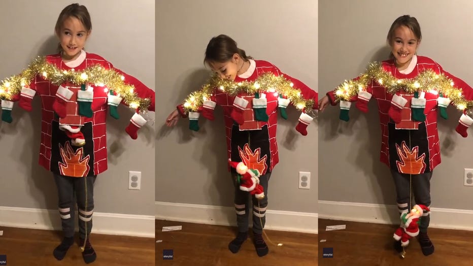 Layla, 8, is pictured wearing her mom’s epic sweater creation in a video posted to Facebook. (Photo credit: Megan Grimes via Storyful)