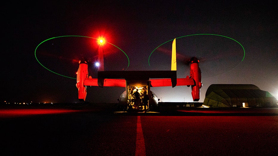 U.S. Marines assigned to Special Purpose Marine Air-Ground Task Force-Crisis Response-Central Command in Kuwait board an MV-22 Osprey bound for Baghdad, Iraq, Dec. 31, 2019.