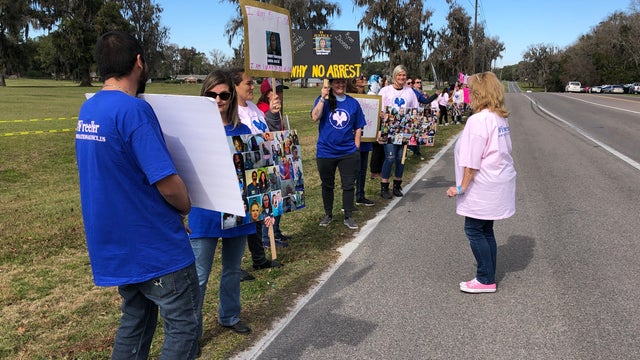 Protesters gather outside Lowell women's prison after correction officer's arrest