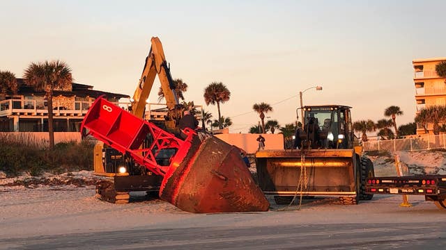 Bye bye, buoy! Officials remove giant buoy from New Smyrna Beach
