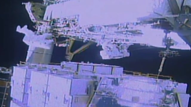 Spacewalking astronauts plug leak in cosmic ray detector