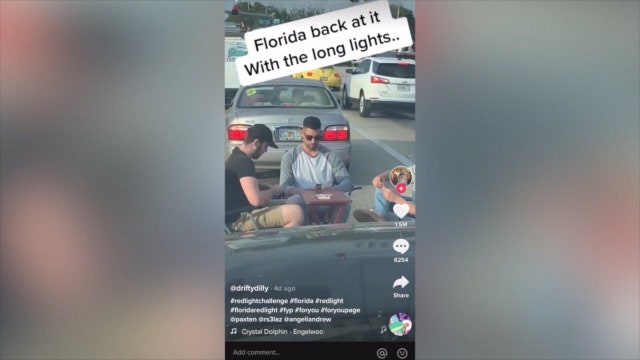 Viral TikTok video shows men playing cards while waiting at Florida intersection