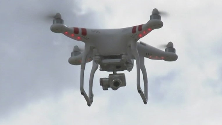 An unmanned aerial quadcopter drone.