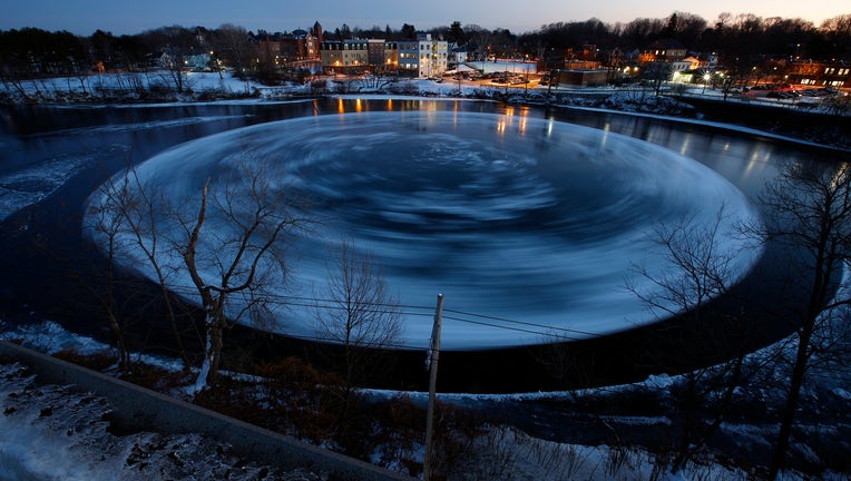 WESTBROOK, ME - JANUARY 14: This 30-second exposure shows a circular ice floe spining counter-clockwise in the Presumpscot River below Bridge Street, as viewed from a nearby parking garage. (Staff photo by Ben McCanna/Portland Portland Press Herald via Getty Images)