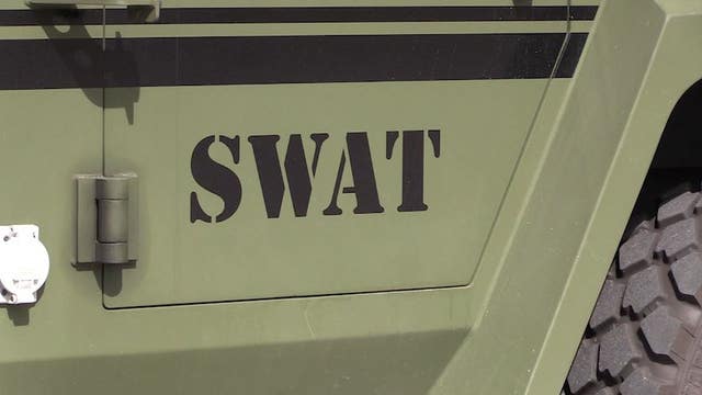 SWAT commander describes intense standoff involving man barricaded inside car