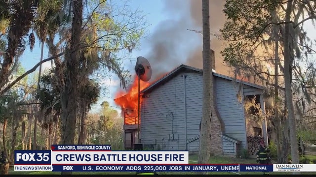Firefighters battle flames in Sanford home containing ammunition